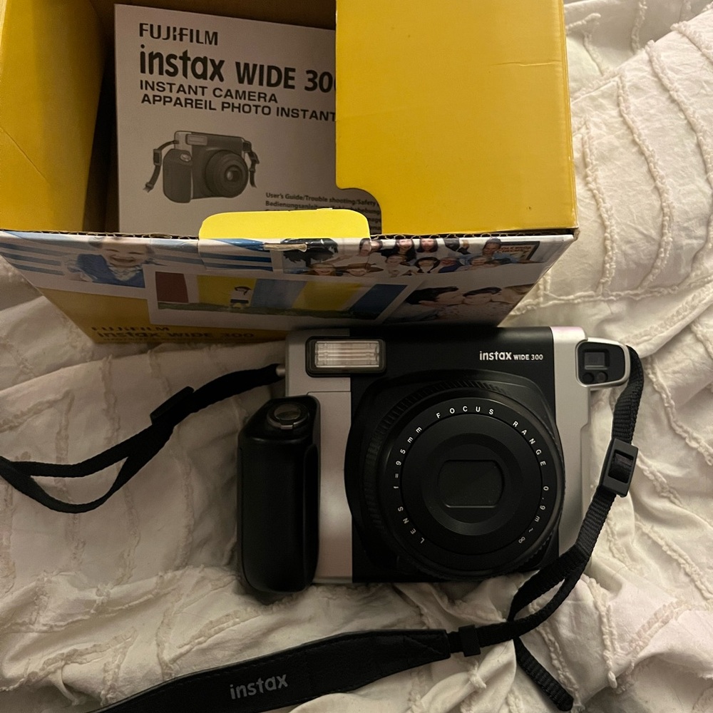 Fujifilm is tax wide 300 polaroid camera